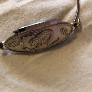 Gold Scorpio bracelet.